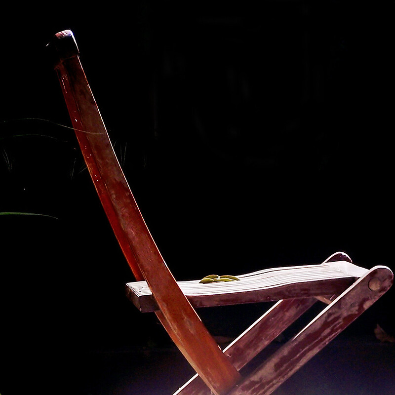 folding wooden chair in the morning sun