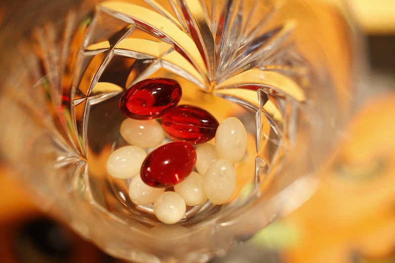 image of a cup of vitamin pills as illustration