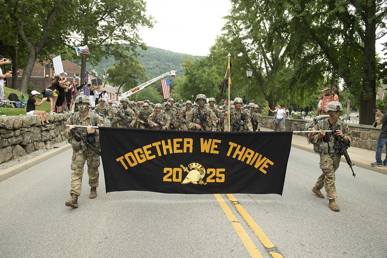 image of a motto banner carried by soldiers on parade