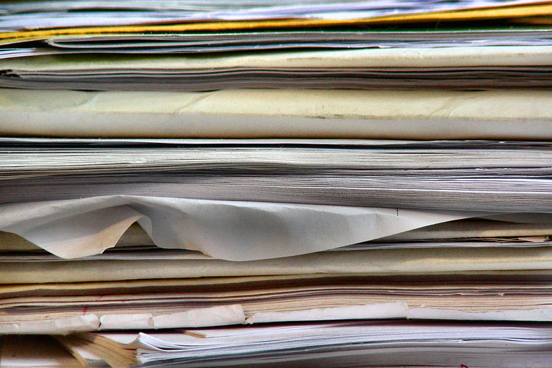 stack of papers, illustrates the words