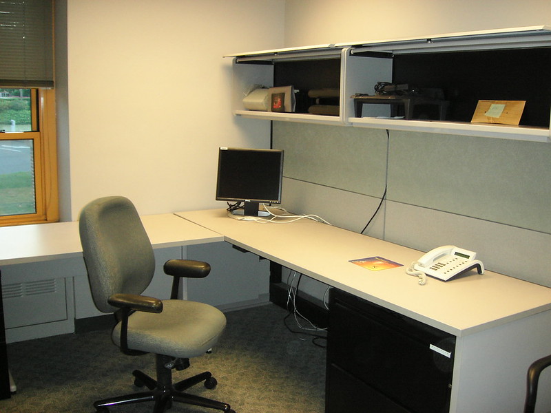 vacant office with desk and chair