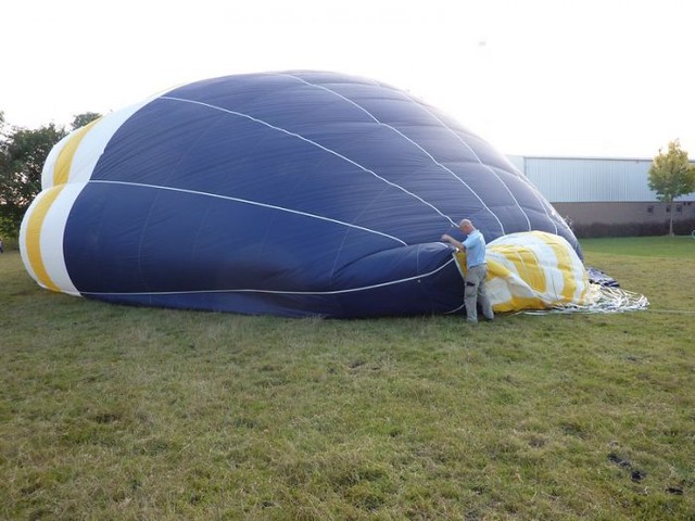 an unfilled air balloon lying on the ground