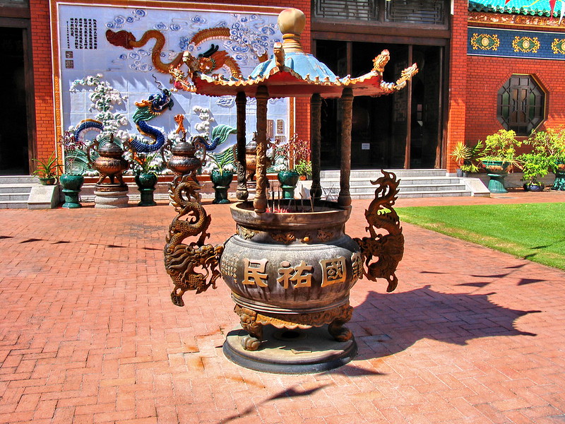 incense burner urn in an open courtyard in front of a Taoist temple